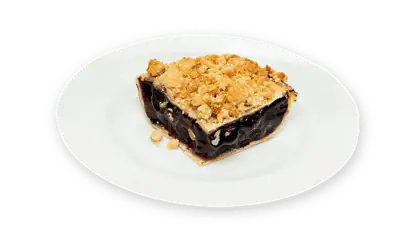 Blueberry pie slice with golden crust and crumble topping, featuring premium IQF fruit, served on a white plate.